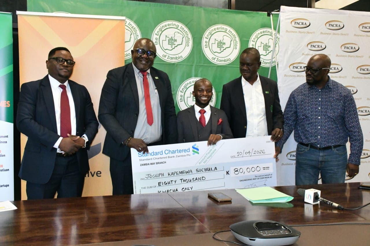 Joseph receiving the EIZ K80,000 grant cheque